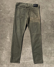 Load image into Gallery viewer, Light Green Distressed and Faded Jeans
